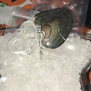 Med key with chain and oyster